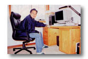 Chi Lam at the desk made by himself